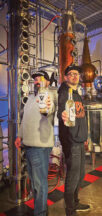 BKO Distillery owners Ken Obloy and Brad Kochmit hold up bottles of Voudoux Vodka, one of the distillery's signature handcrafted ultra-premium spirits. Photo submitted